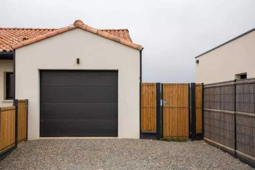 Image Ressort porte de garage sectionnelle cassé