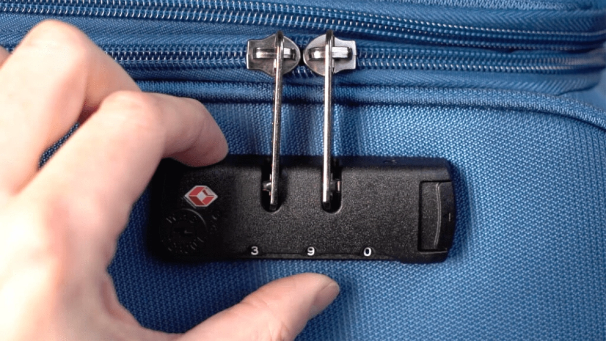 Image Comment changer le code de la serrure d’une valise ?