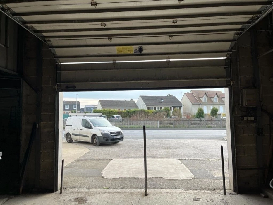 Réparation porte sectionnelle à Menucourt